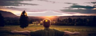 woman exercising arms in nature